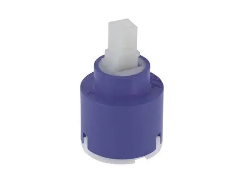 Kartusche in Lila mit weißem Anschluss, möglicherweise von Ideal Standard, zur Verwendung in Armaturen. Design ermöglicht einfache Installation und Wartung.
